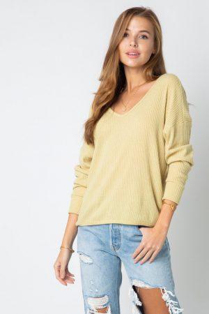 Ribbed solid long sleeve top with twisted back.