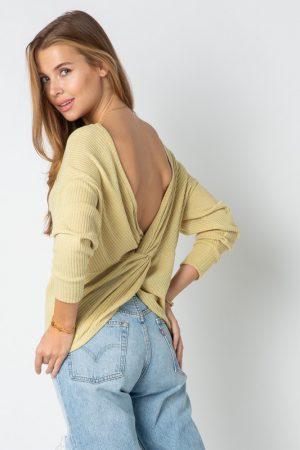 Ribbed solid long sleeve top with twisted back.